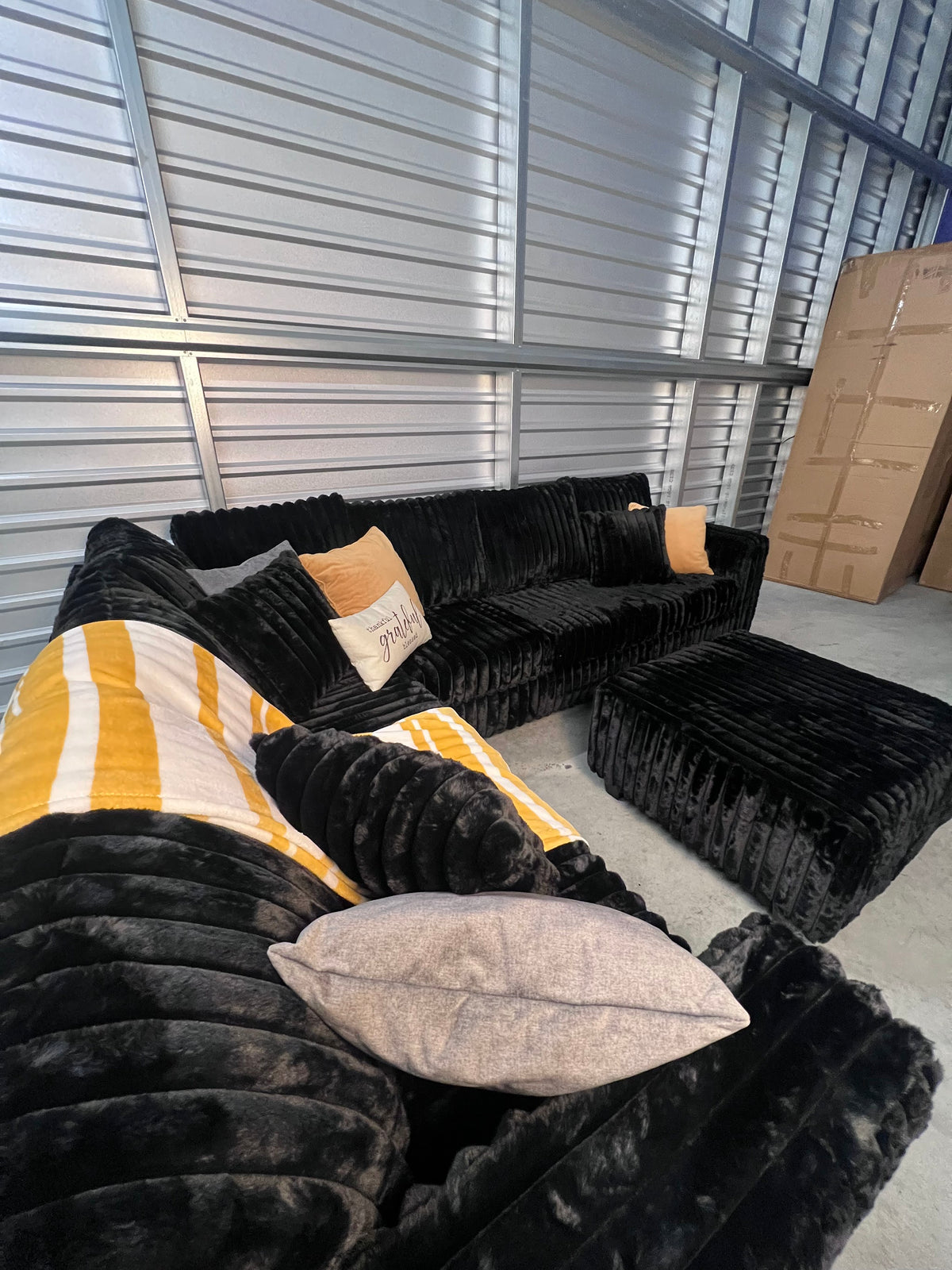 Upgraded corduroy sectional in Black, with ottoman