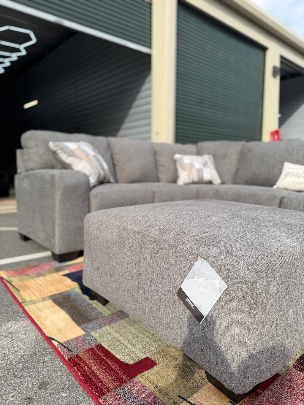 Ashley Newellen sectional, right chaise, ottoman close-up