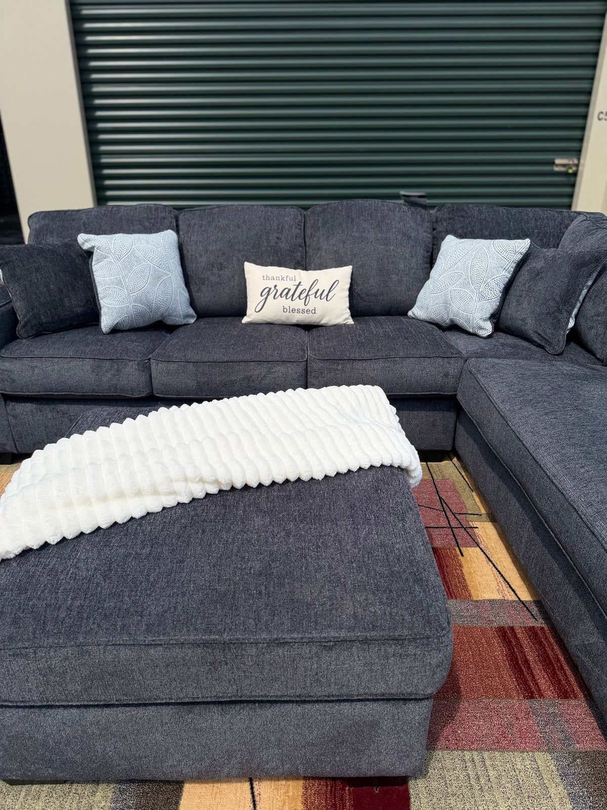Ashley Altari sectional in Slate, right chaise, with ottoman