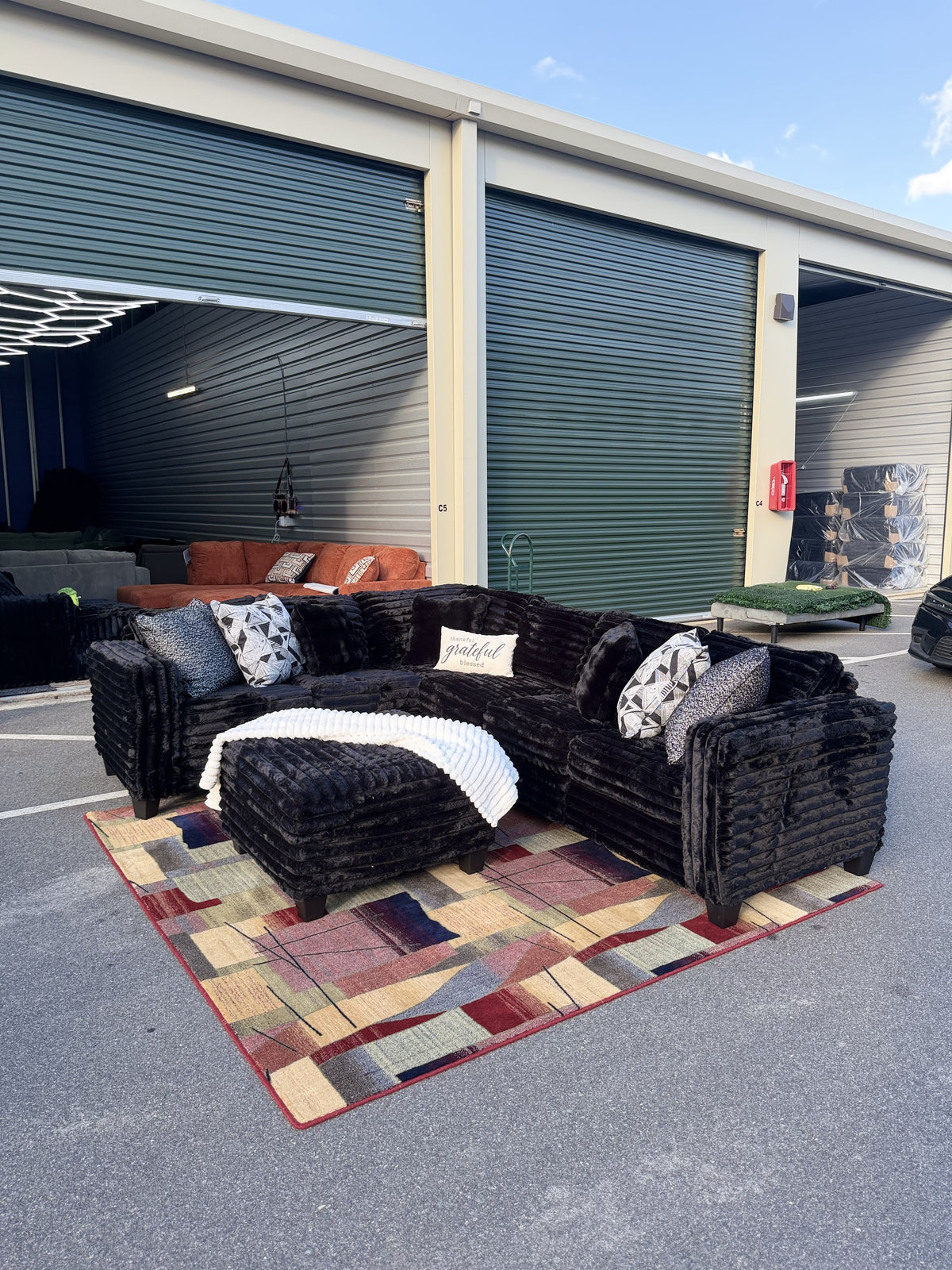 Black corduroy sectional with ottoman