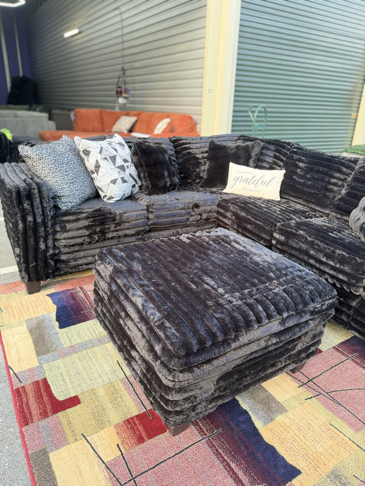 Black corduroy sectional full showroom view