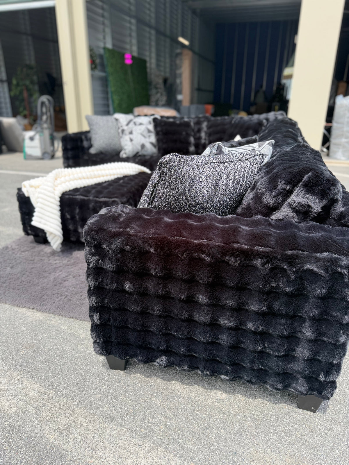 Waffle corduroy sectional in Black, arm detail