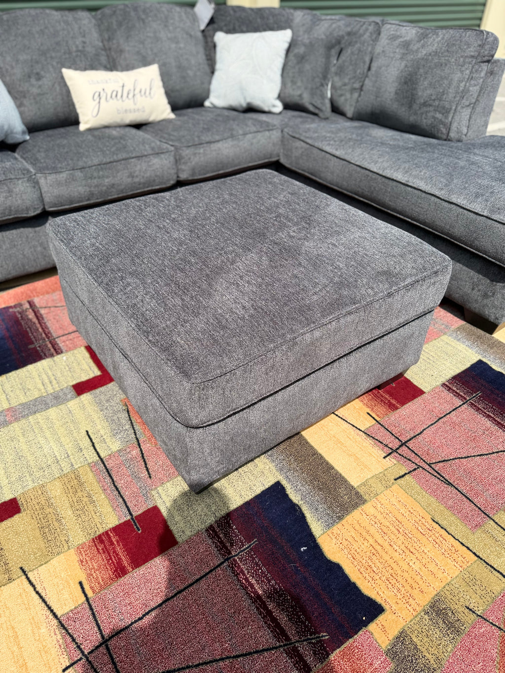 Ashley Altari sectional in Slate, right chaise, ottoman view