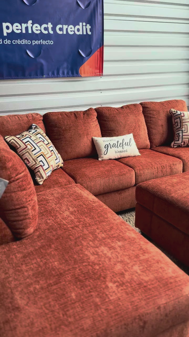 Burnt orange sectional chaise, close-up