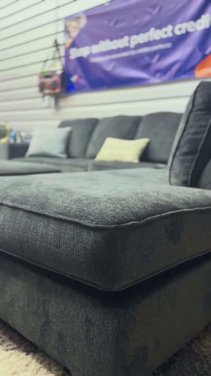 Grey sectional with chaise, close-up