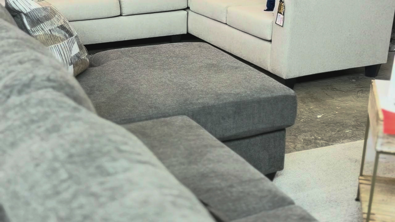 Grey and white sectionals in the showroom