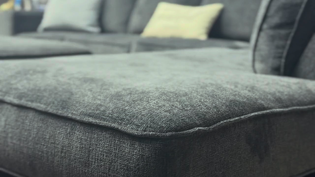 Grey sectional with chaise, close-up